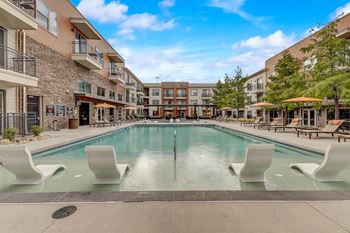 Resort-style pool courtyard with sun deck